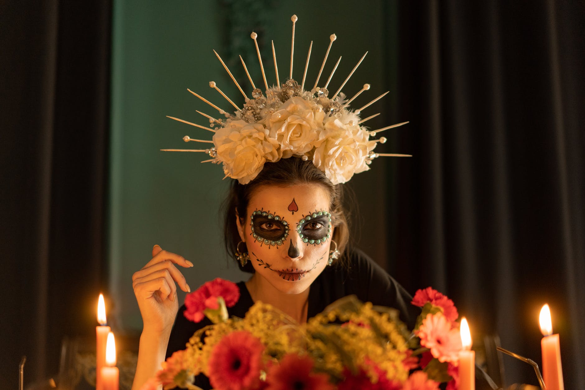 woman in skeleton make up with floral crown headdress